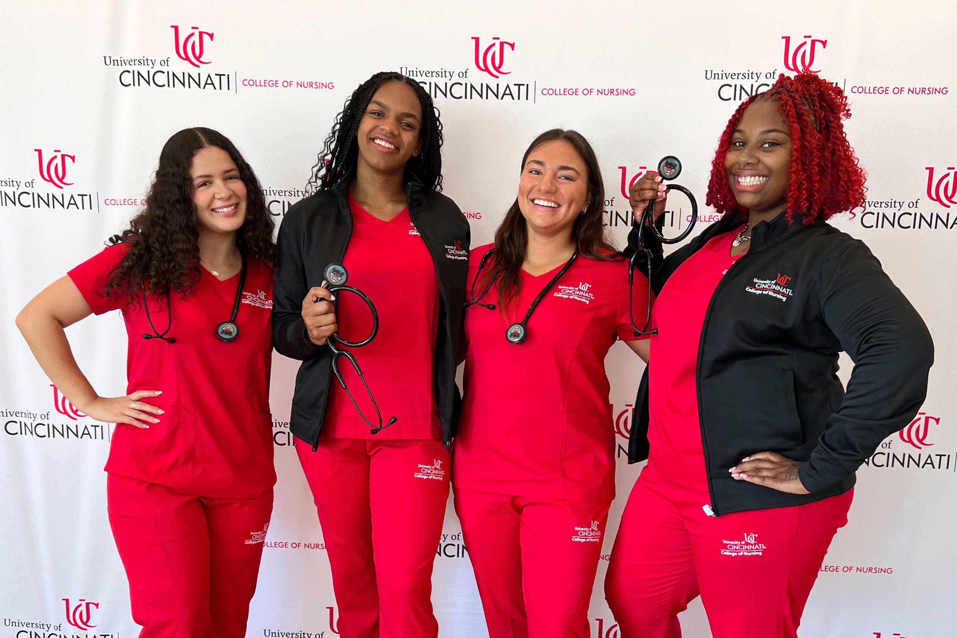 4 nursing students in scrubs