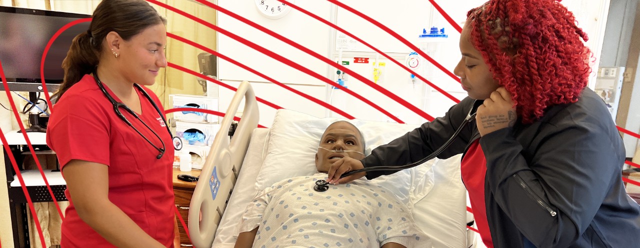 students with manikin in simulation lab