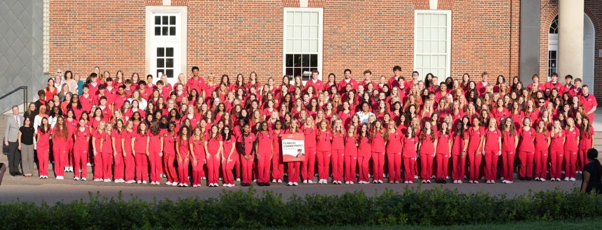 nursing students wearing red scrubs