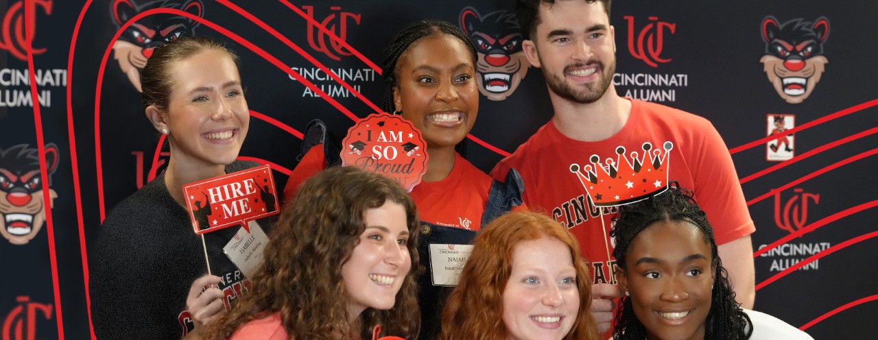 a group of students in front of black background